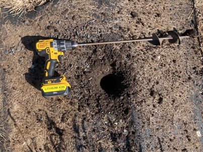 The Bald Butte Lavender Farm's diging planting hole with auger attachment.